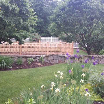 A vegetable garden behind the stone wall
