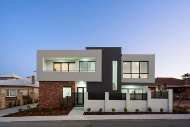 Diseño de fachada de casa pareada actual de dos plantas con revestimiento de aglomerado de cemento
