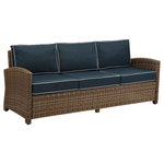 Crosley - Bradenton Sofa With Navy Cushions, Cushions: Navy - A comfortable, traditional design gets a preppy update in the chic Bradenton Outdoor Sofa. A woven wicker frame — made with all-weather, UV-resistant materials — in a warm brown tone contrasts with three sections of moisture-resistant cushions, each with high-grade cores and contrast piping. Set up this seat on your porch or patio, then kick back in the sunshine to celebrate your beautiful design.