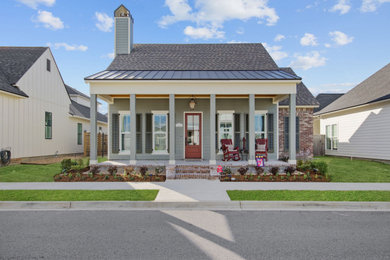 Example of a country exterior home design in New Orleans