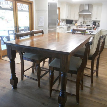 Counter high farm table with turned legs.