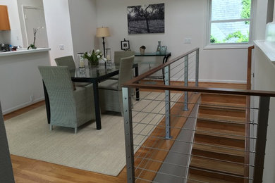 Mid-sized trendy wooden straight mixed material railing staircase photo in Houston with wooden risers