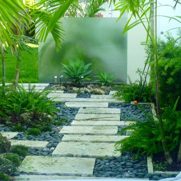 Stepping stone walkway with glass walls