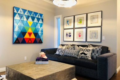 Inspiration for a mid-sized contemporary enclosed dark wood floor and brown floor family room remodel in Calgary with gray walls