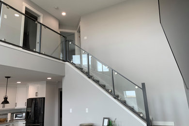 Staircase - contemporary straight mixed material railing staircase idea in Calgary