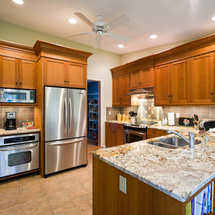 Mid-sized traditional kitchen pantry remodeling - Mid-sized elegant u-shaped ceramic floor and beige floor kitchen pantry photo in Bridgeport with a double-bowl sink, shaker cabinets, medium tone wood cabinets, granite countertops, beige backsplash, terra-cotta backsplash, stainless steel appliances and a peninsula