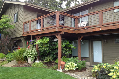 Large beach style home design photo in Seattle
