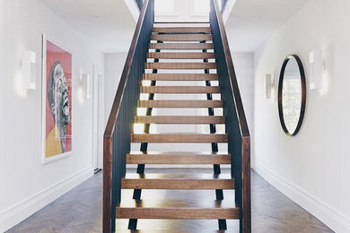 Staircase - mid-sized contemporary staircase idea in New York