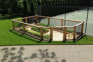 Mid-sized country backyard full sun formal garden in New York with a vegetable garden.