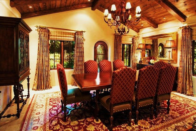Inspiration for a mediterranean concrete floor and beige floor enclosed dining room remodel in Seattle with beige walls and no fireplace