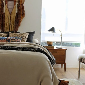 Modern Tonal Bedroom with African Mudcloth and Sheepskin Rug