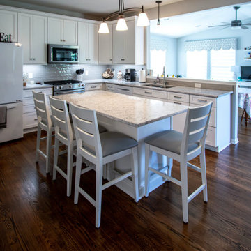 White Shaker Kitchen w/ Pietra Quartz Countertops & Gray Subway Tile Backsplash