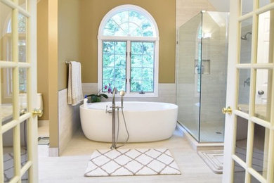 Bright Spa Bath with French Doors and Window