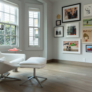Modern home office and library in Boston with orange walls.