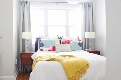 Bedroom - mid-sized eclectic master medium tone wood floor and brown floor bedroom idea in Philadelphia with white walls and no fireplace