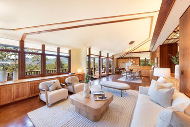 Example of a small mid-century modern concrete floor, brown floor and vaulted ceiling living room design in San Francisco with white walls