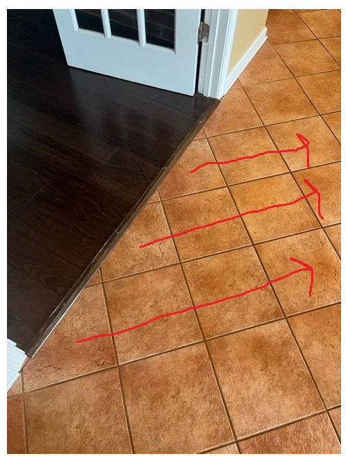 Changing direction of flooring between rooms