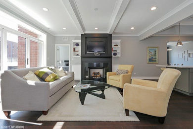 Example of a mid-sized trendy open concept dark wood floor living room design in Chicago with gray walls, a standard fireplace, a metal fireplace and a wall-mounted tv