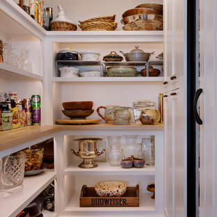 Photo of a mid-sized arts and crafts l-shaped kitchen pantry in Los Angeles with an undermount sink, shaker cabinets, white cabinets, quartzite benchtops, white splashback, stone slab splashback, stainless steel appliances, light hardwood floors, with island and beige floor.