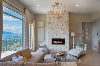 Living room - rustic living room idea in Vancouver with a stone fireplace