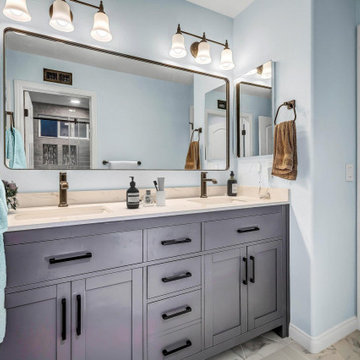 This shared bathroom remodel in Aliso Viejo showcases a spa-like walk-in shower