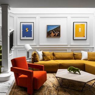 Mid-sized eclectic formal loft-style living room in Melbourne with white walls, porcelain floors, a wall-mounted tv, multi-coloured floor and decorative wall panelling.