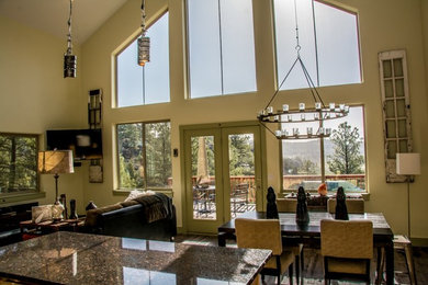 Inspiration for a contemporary open concept living room remodel in Denver with a wall-mounted tv