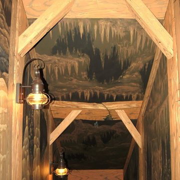 The Bat Cave Themed Mural in a stairway and lower level by Tom Taylor