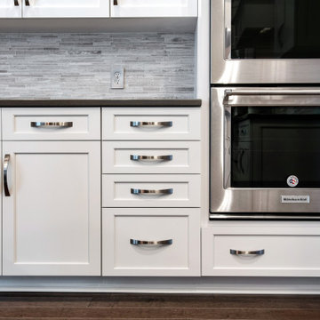 Contrasting White and Dark Gray Cabinets and Countertops in Crownsville, MD