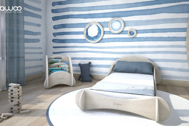 Idee per una cameretta per bambini da 1 a 3 anni stile marinaro con pareti blu e carta da parati