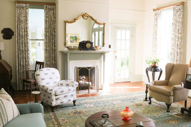 Living room - mid-sized transitional formal and open concept medium tone wood floor living room idea in Atlanta with white walls, a standard fireplace and a wood fireplace surround