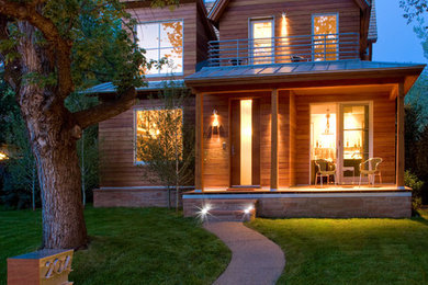 Transitional brown two-story wood exterior home idea in Denver
