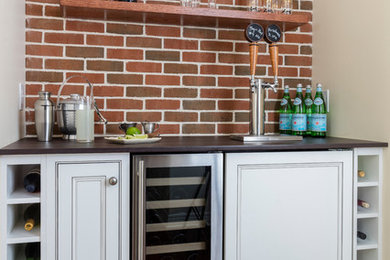 Transitional home bar photo in New York