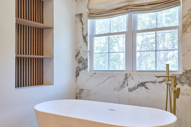Freestanding bathtub - modern marble tile marble floor freestanding bathtub idea in Philadelphia