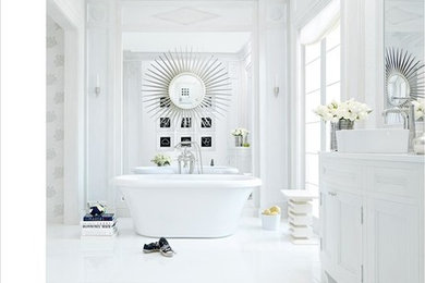 Photo of a transitional bathroom in DC Metro with white tile, stone tile, white walls and marble floors.