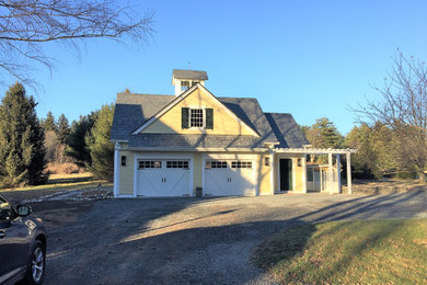 Mid-sized country yellow two-story vinyl exterior home idea in Philadelphia with a shingle roof