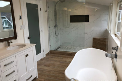 Inspiration for a master white tile and ceramic tile brown floor and double-sink freestanding bathtub remodel in Other with a one-piece toilet, white countertops and a freestanding vanity