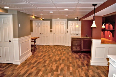 Basement game room - large transitional underground carpeted, gray floor and vaulted ceiling basement game room idea in Philadelphia with gray walls