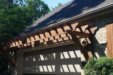 Inspiration for a mid-sized timeless beige two-story brick exterior home remodel in Chicago with a shingle roof