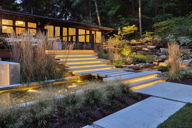 Immagine di un giardino moderno con scale