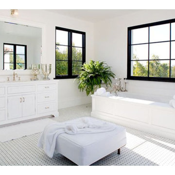 All White Bathroom with Black and White Penny Tile Design
