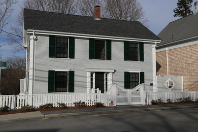 Inspiration for a large traditional two-storey grey exterior in Boston with wood siding.