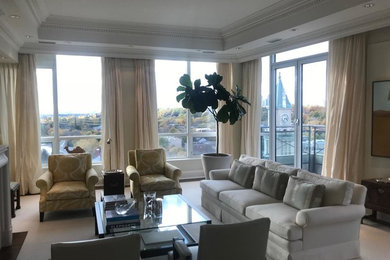 Mid-sized elegant formal and open concept carpeted and white floor living room photo in Toronto with white walls, a standard fireplace, a concrete fireplace and no tv