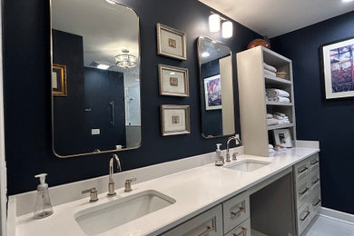 Mid-sized minimalist master bathroom photo in Nashville with raised-panel cabinets and white countertops
