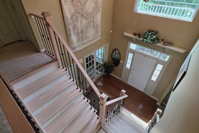Example of a mid-sized minimalist wooden l-shaped mixed material railing staircase design in New York with wooden risers