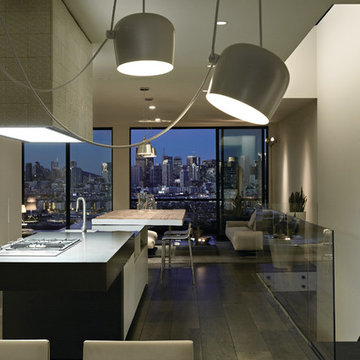 Kitchen, lounge and evening city skyline.