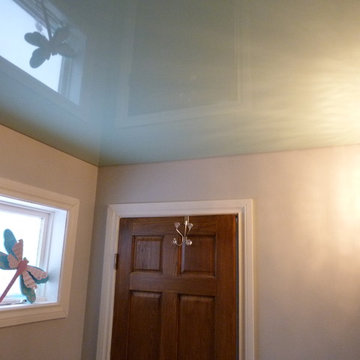 Mint green high gloss Phoenix Stretch Ceiling in a bathroom above the shower