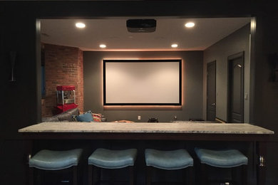 Mid-sized transitional enclosed carpeted and beige floor home theater photo in Indianapolis with multicolored walls and a projector screen