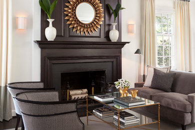 Photo of a traditional formal living room in DC Metro with white walls and a standard fireplace.