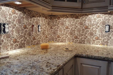 Example of an eclectic l-shaped eat-in kitchen design in Baltimore